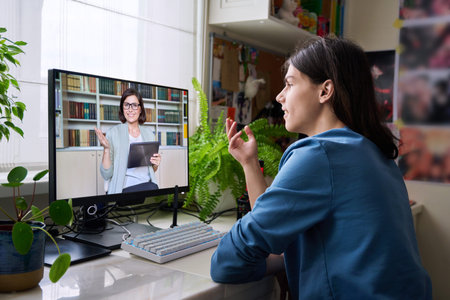 Online consultation of male student by social worker, psychologist, teacherの写真素材