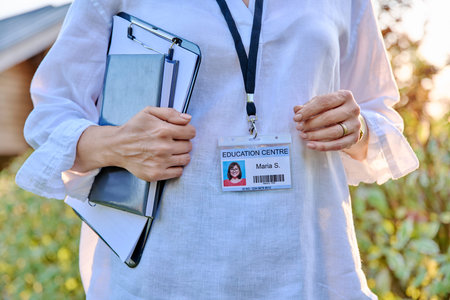 Close-up of badge on woman worker of educational center