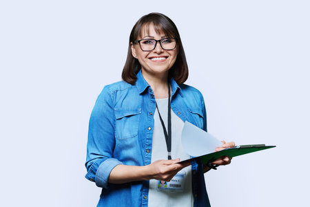 Portrait of woman worker with industrial center card clipboard, on white background