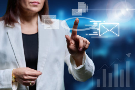 Business woman hands pointing at interface with electronic communicationの写真素材