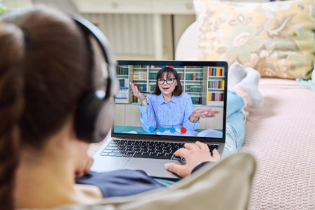 Video conference, teen girl student talking to teacher on screen