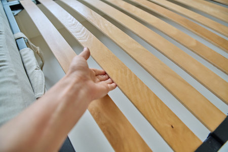 Close-up of wooden slats on the bedの写真素材