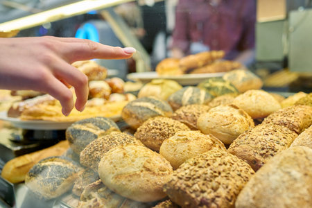 Close-up of bakery pastry shop display with fresh buns