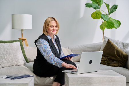 Female psychologist having online session, using laptopの写真素材