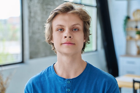 Headshot portrait of serious teenage boy looking at cameraの写真素材