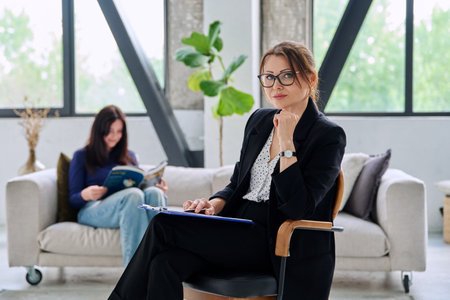 Portrait of female journalist, employer, interviewer in officeの写真素材