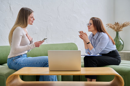Mental therapy session, female professional psychologist working with young woman patientの写真素材