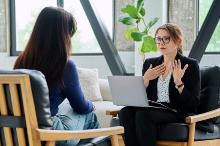 Female mental health professional working with young woman