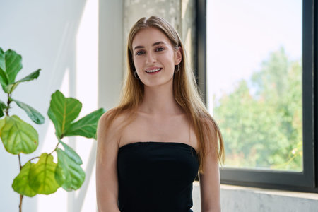 Portrait of beautiful fashionable young blonde woman with long hair
