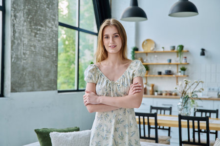 Portrait young beautiful blonde female 18-20 years old in home interiorの写真素材