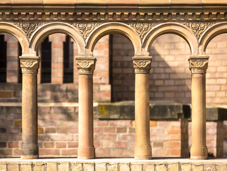 Columns in a row with terra cotta ornates, seen at a church from the early 19th century, built in the antique style.の写真素材