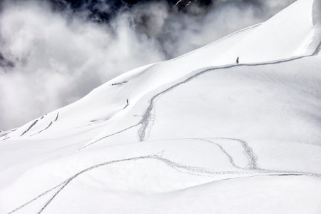 View of the snow-covered mountains of the Mont Blanc massif. You can see the traces of the hikers...