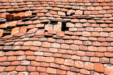 Damaged roof with old roof tiles. Was seen in Brandenburg.