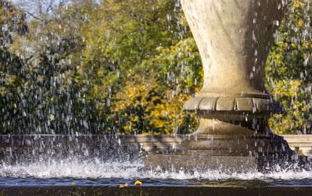 Fresh water fontaine, sunny day in colorful autumn.の写真素材