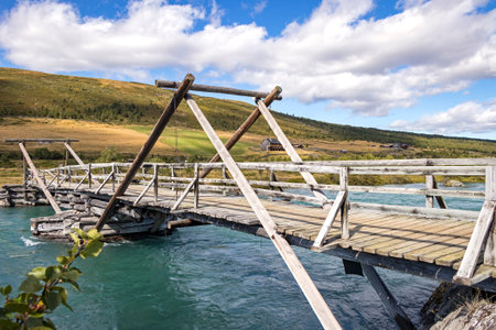 Traditional wooden bridge over the River Sjoa, Jotunheimen National Park, Norway