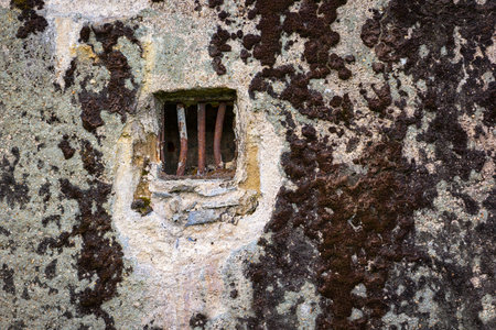 Detail of a bunker with a small window. Everywhere in Europe there are still these legacies of the...