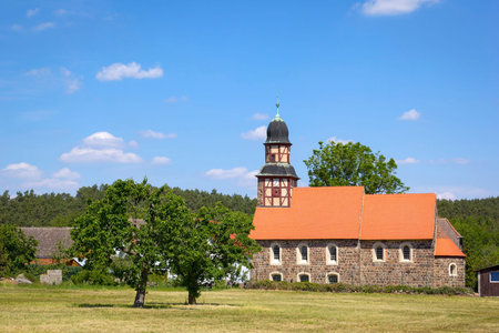 View of the small half-timbered church in the village of Raben, Hohen Flaeming, Brandenburg. In the...