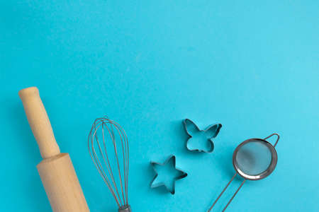 Different baking tools on blue background, top view. Baking and cooking conceptの写真素材
