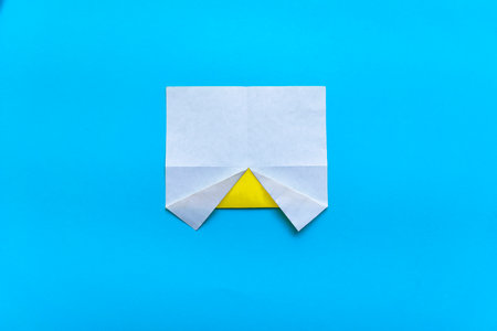 Step by step photo instruction how to make origami paper car. Simple diy with kids children's concept. Step 3.の写真素材
