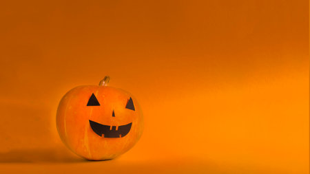 pumpkin halloween on orange background with copy spaceの写真素材