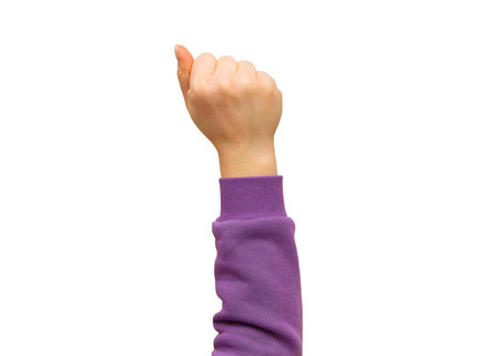 Woman hand with clenched fist on isolated white background.の写真素材