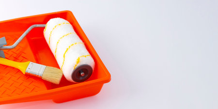 Paint can, roller and paint tray for painting wall on the floor.の写真素材