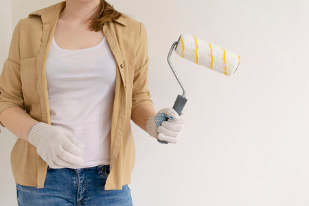 Paint can, roller and paint tray for painting wall on the floorの写真素材