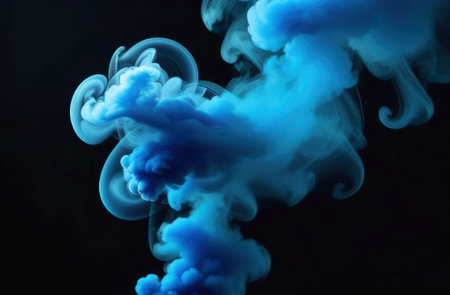 colorful blue smoke against black background close up, modern art background.の素材