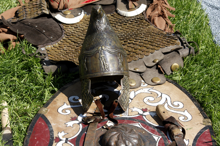Ancient helmet, shield and armor on displayの写真素材