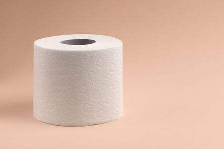 Toilet paper on light background. Toilet paper roll tissue. Health care concept. Coronavirus panic concept. People are stocking up toilet paper for home quarantine from coronavirusの写真素材