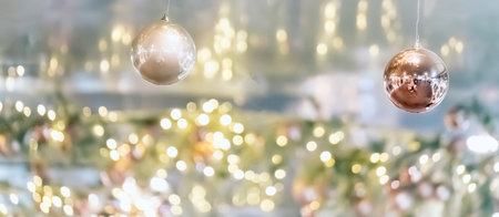 Ceiling christmas decorations in modern mall, shopping center or exhibition place on blurred bokeh background. Baubles hanging on trees branchの写真素材