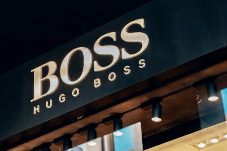 Hugo Boss logo store in Milans Fashion District, Montenapoleone area. Hugo Boss is a German luxury fashion house, produces clothing, accessories, footwear and fragrances. Milan, Italy - 24.09.2020のeditorial素材