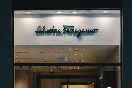 Salvatore Ferragamo logo and showcase of the store. Salvatore Ferragamo specialize in luxury goods high-end retailer. Bergamo, Italy - 29.12.2019のeditorial素材