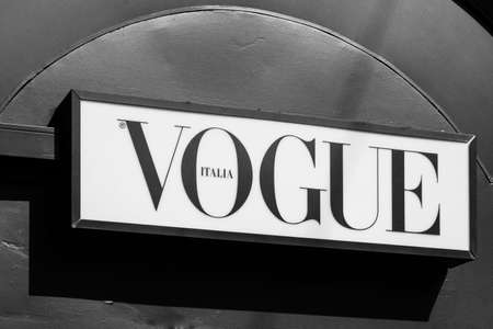 Vogue brand logo sign on a newspaper kiosk. Vogue is monthly fashion and lifestyle magazine covering many topics, including fashion, beauty, culture, living, and runway. Milan, Italy - 24.09.2020のeditorial素材