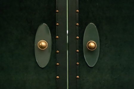 Vintage door handle. Copper door knob on emerald green door.