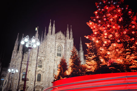 Milan, Italy - December, 15, 2020: Christmas tree in front of Milan cathedral, Duomo square in december, night view. Decorated tree in european downtown. Christmas in Europeのeditorial素材