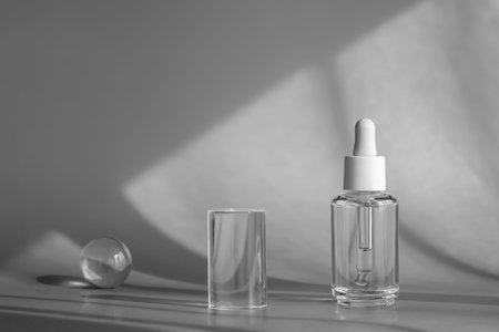 Glass cosmetic bottle, serum with peptides and retinol product packaging and modern acrylic...