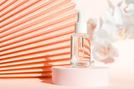 Cosmetic serum with peptides product presentation mockup on podium pedestal and chinese paper fan pink floral background. Face cream moisturizer showcase, luxury skincare spa cosmetics.の写真素材