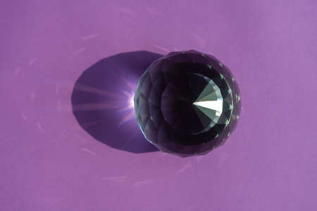 Crystal prism refracting light, magic crystals and pyramid, sphere and cube on purple background. Spiritual healing crystal practice. Feng Shui, good energy flow concept, esoteric background..の写真素材