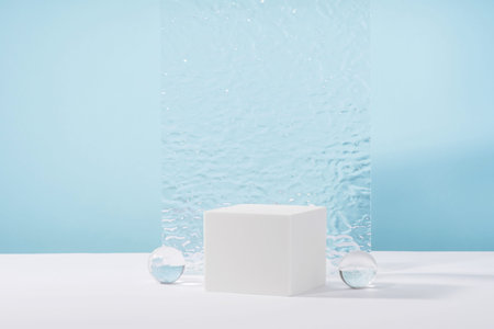 Showcase for jewellery presentation, display for advertising, cosmetics branding scene mockup. Acrylic plate, podium, background for cosmetic product packaging on blue backdrop with stylish props.の写真素材