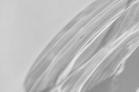 Shadow and light refraction on white wall overlay photo effect, sun rays refracting through glass...
