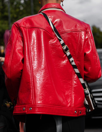 Milan, Italy - September, 21, 2022: man wearing Red rayon-cotton blend cotton J-Lou patent shirt jacket from DIESEL, street style outfit details.のeditorial素材