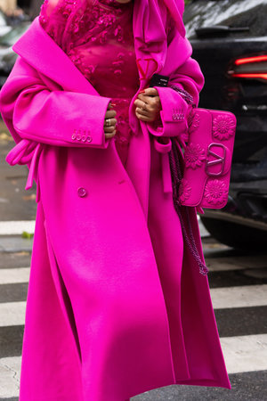 Paris, France - October, 2, 2022: woman wears fuchsia wool and cashmere blend coat and pink Valentino Garavani leather shoulder bag, street style detailsのeditorial素材