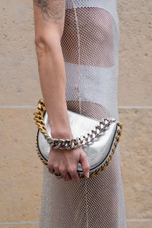 Paris, France - October, 3, 2022: man wears meshy reticulated dress and silver chain bag from StellaMcCartney, street style details.のeditorial素材