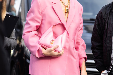 Paris, France - October, 2, 2022: woman wearing pink mini G-Hobo bag from Givenchy, street style outfit details.のeditorial素材