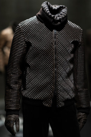 Italy, Milan - 04 December, 2022: Permanent exhibition space with luxury dresses and costumes. Armani Silos, the fashion art space in Milan dedicated to the Armani style. Man and woman outfits.のeditorial素材