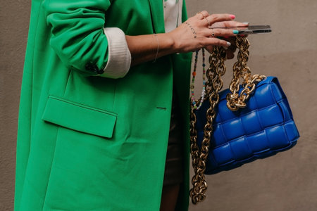 Paris, France - October, 3, 2021: woman wears handbag Bottega Veneta blue leather shoulder bag, street style detailsのeditorial素材