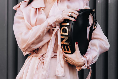Milan, Italy - February, 23, 2022: woman wears black leather Fendi Fendigraphy, street style details