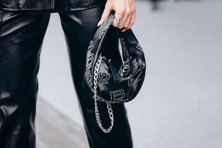 Milan, Italy - February, 24, 2022: woman wears crush stud-embellished tote bag By Far, street style detailsのeditorial素材
