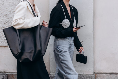 Milan, Italy - February, 23, 2022: woman wears leather shopping bag, street style detailsのeditorial素材